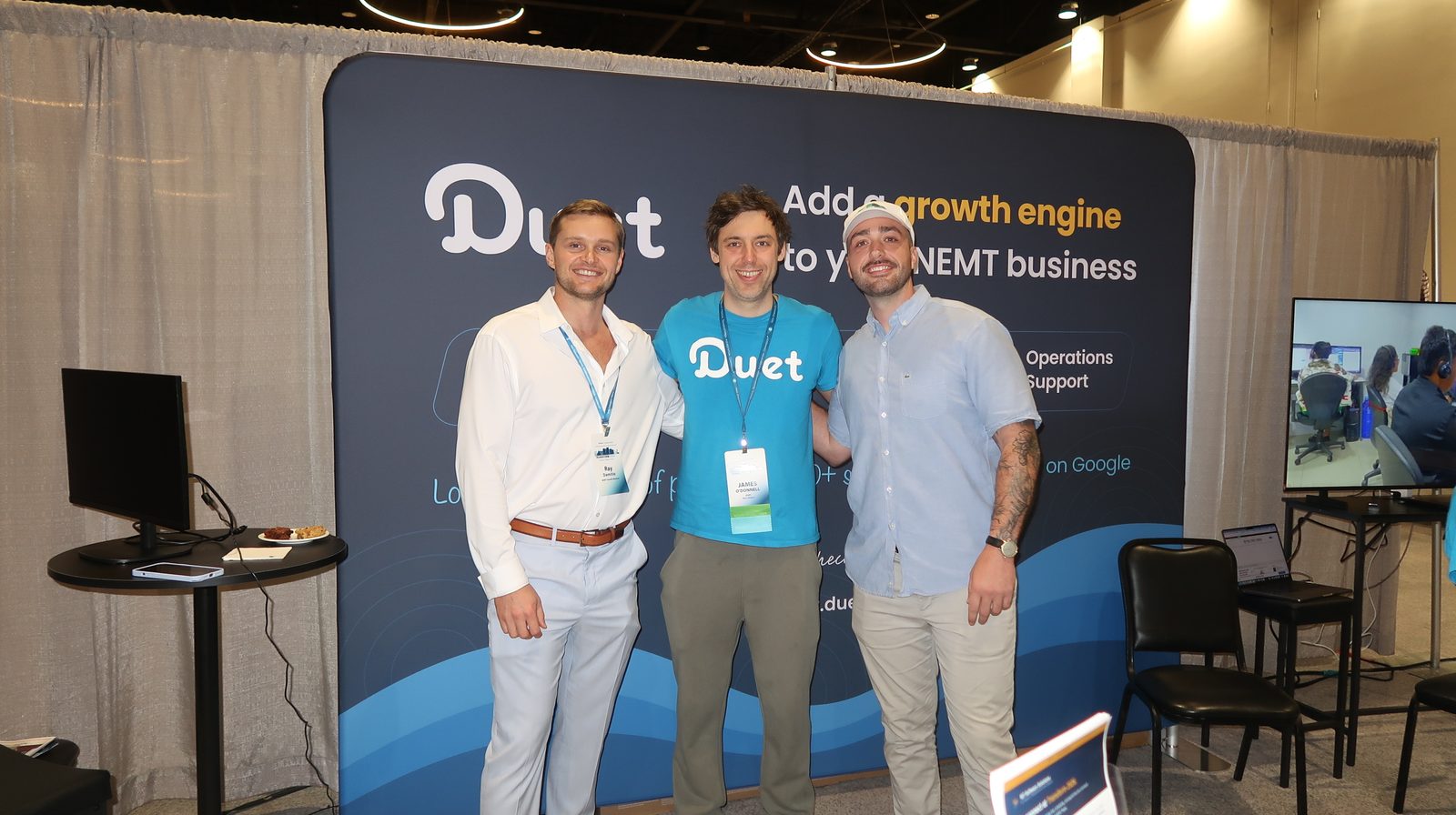 Ray Damitio and Mac Andrews with James O’Donnell of Duet at their conference booth
